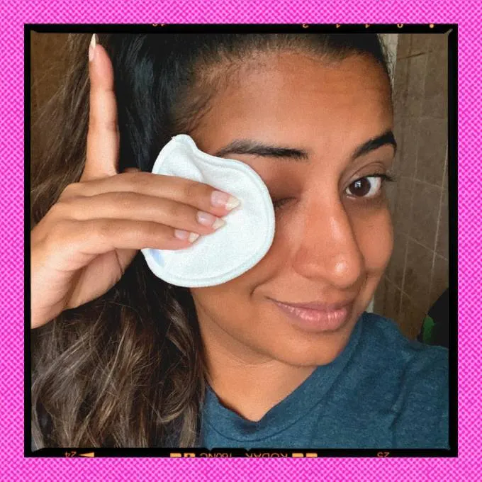 Hanna Ibrahim removes her eye makeup with a cotton ball