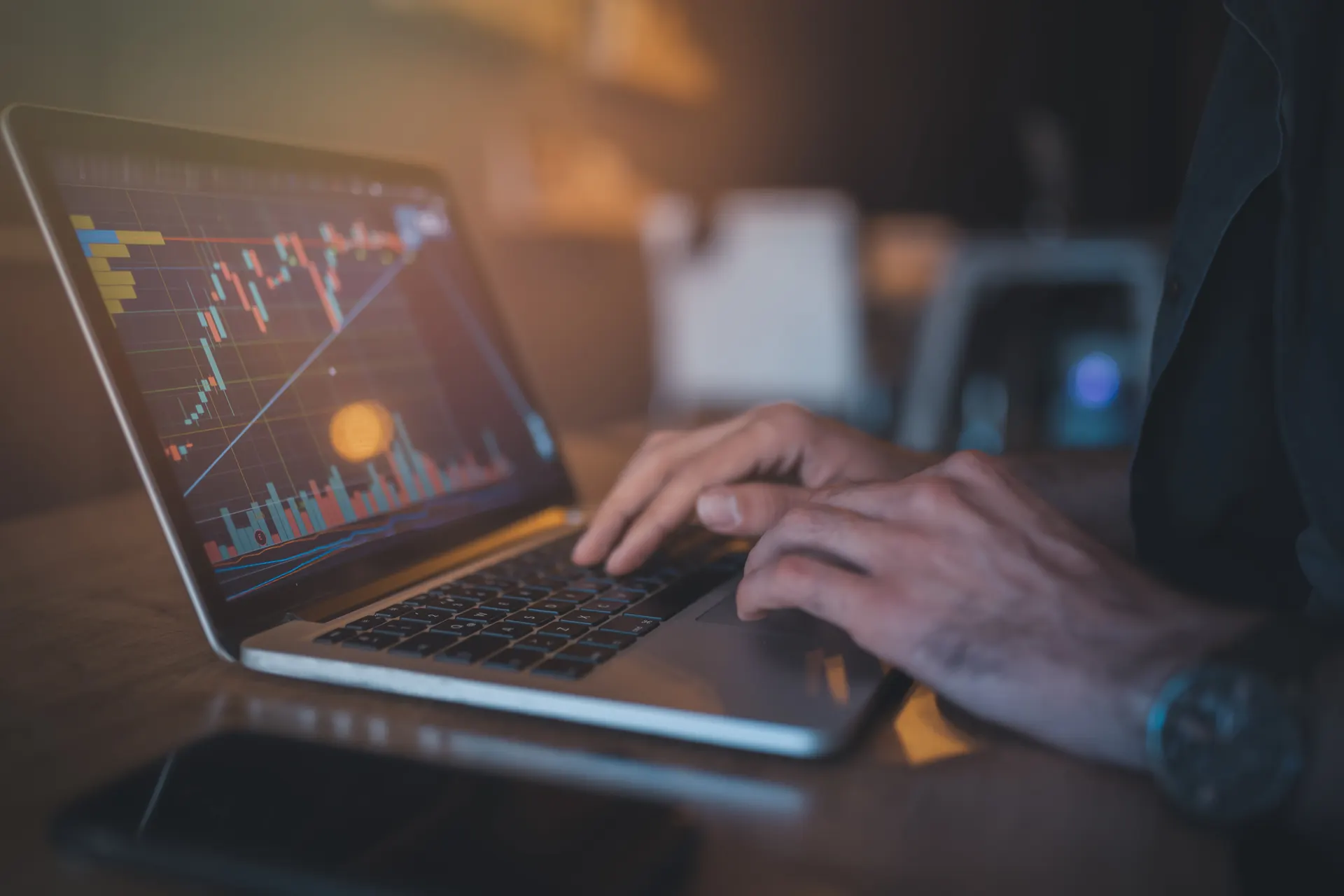 Person relaxing in front of a computer as they watch the crypto market.