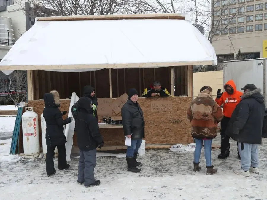 Anti-vaccine mandate protesters and truckers protesting their eighth day in Ottawa Friday.  A building has been built on NCC property near the Rideau Canal.