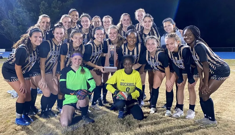The Buchholz Bobcats' girls' soccer team celebrates winning the 2-6A district championship over Tallahassee Lincoln on Feb.  1 at Saint Francis Catholic High School.